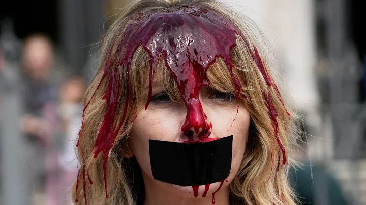 Video. Activists covered in red paint protest bullfighting in Pamplona